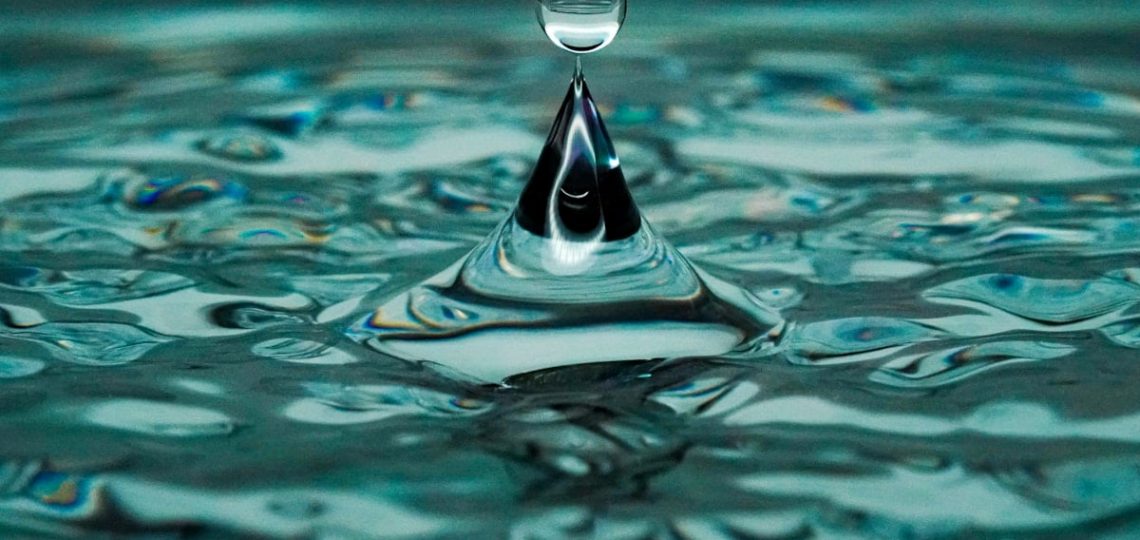 water drop on body of water